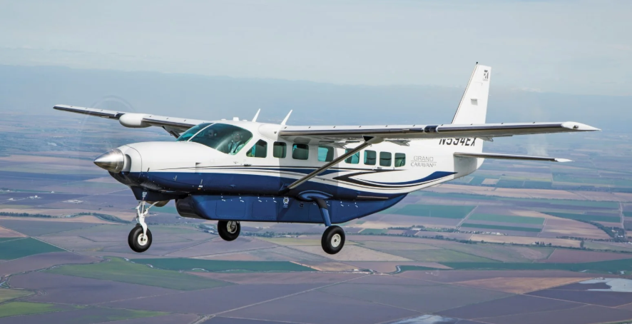 Cessna Grand Caravan 208B in flight over savannah